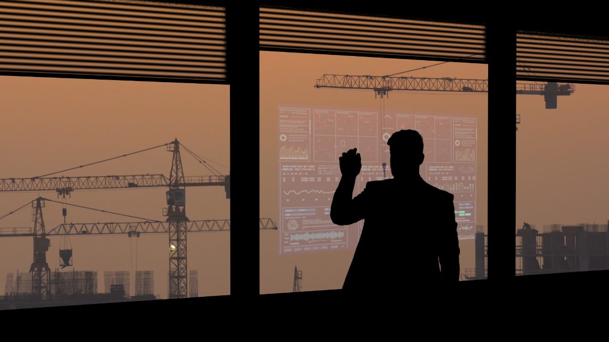 Construction professional in front of a skyline with cranes